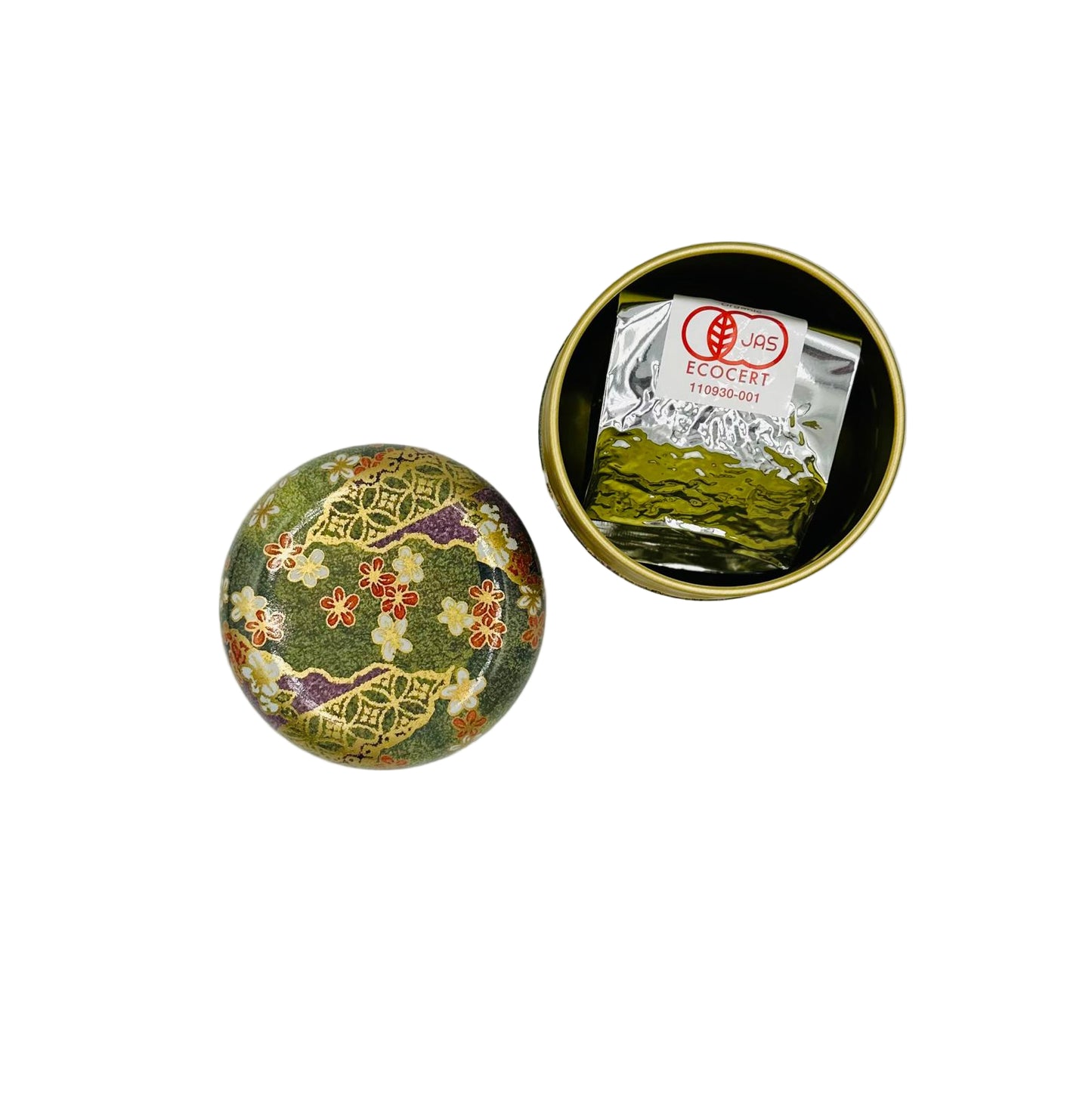 Decorative tin with floral design containing a tea bag on a light gray background